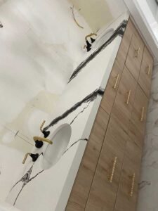Quartzite countertop with dramatic natural veining on a kitchen island in Tampa Bay