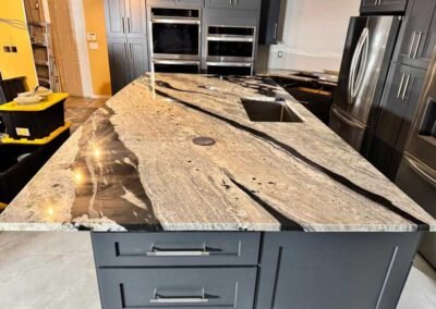 Quartzite countertop with dramatic natural veining on a kitchen island in Tampa Bay